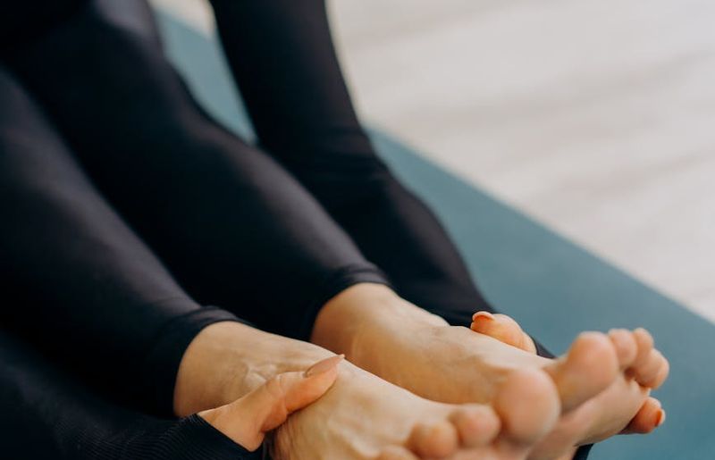 Close-up of a person's hands in a meditative yoga pose.